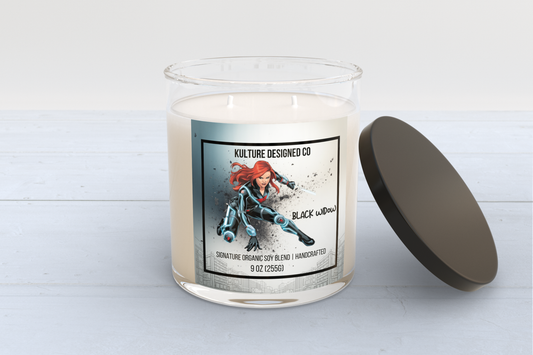 Candle with a 'Black Widow' themed label on a white background