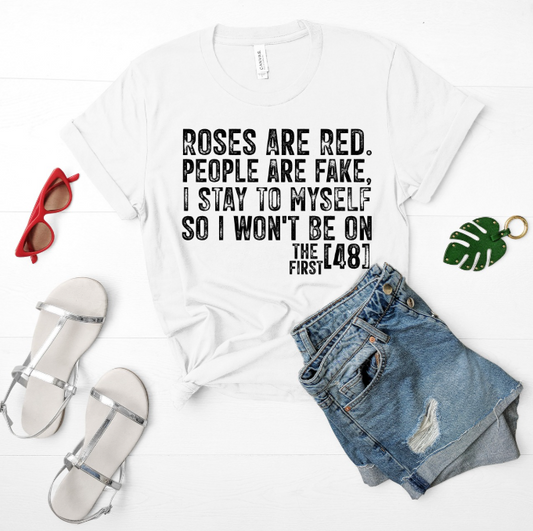 White t-shirt with humorous text, sunglasses, sandals, and denim shorts on a white background