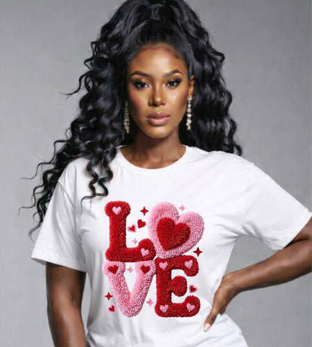 Woman wearing a white t-shirt with 'LOVE' printed in red and pink hearts on a gray background