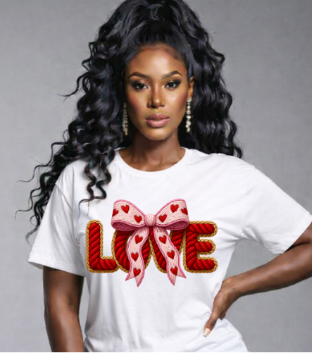 Woman wearing a white t-shirt with a decorative 'LOVE' design on a gray background