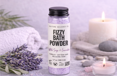 Bottle of Fizzy Bath Powder with lavender flowers and candles on a light background